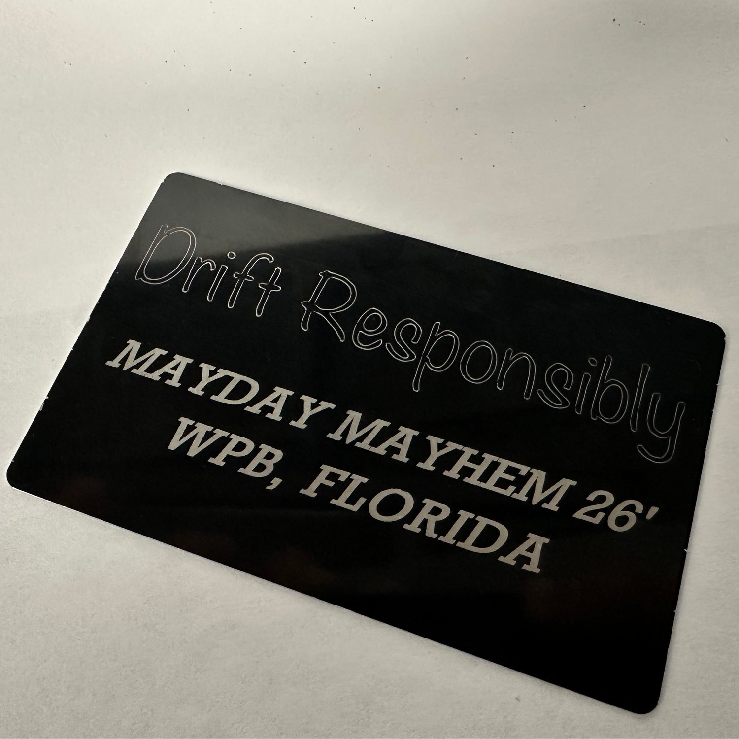 Black card with white text on a light gray background