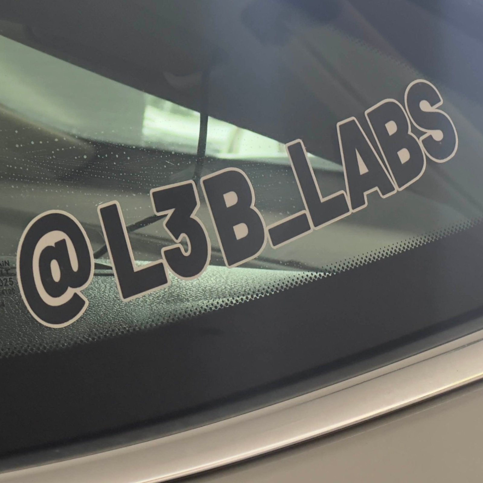 Custom Social Media Handle Decal - L3B LABS On a Window of a BMW Car